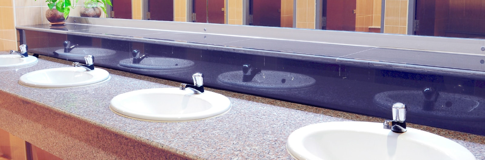 A row of sinks in a bathroom