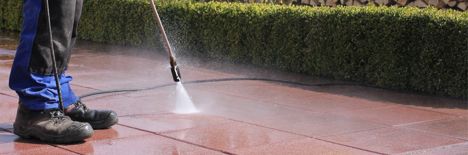 A cleaner jetwashing pavement slabs
