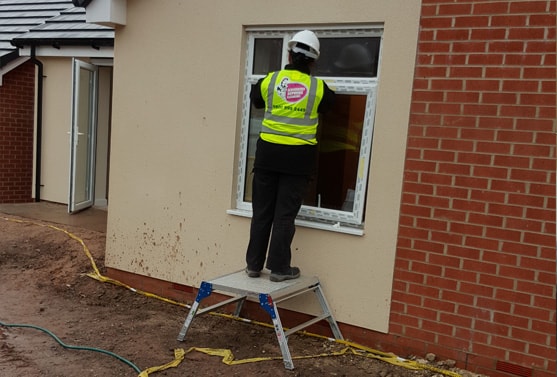 Woman cleaning an outside window